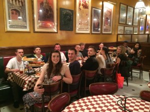 Bellevue DECA dining on pizza before the Collegiate DECA 2015 ICDC: Dillon, Keith, Madison, Kyle, Daniel, Dan, Andy, Dorel, Olivia, Conner, Susan, Gabe, Vincy, Charlize